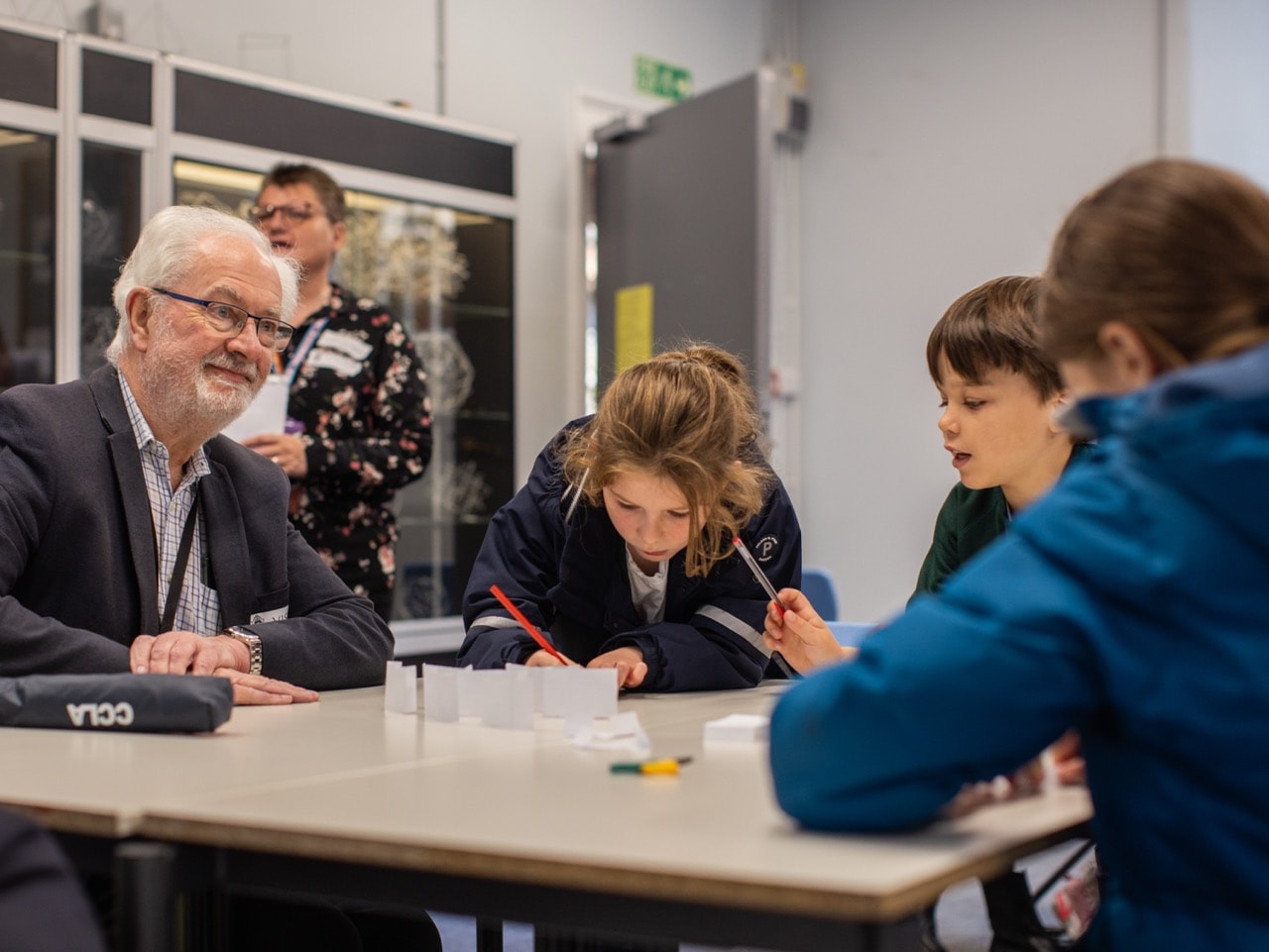 Councillor Stephen Parker joins students in their workshop.